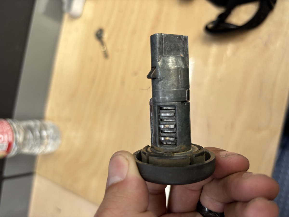 Car ignition cylinder disassembled during automotive locksmith service